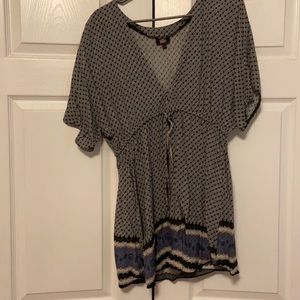Navy blue patterned v neck top with elastic detail
